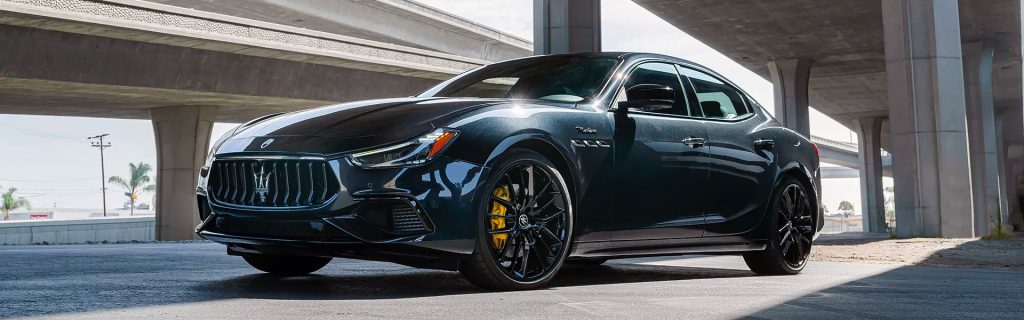Maserati Ghibli riding in a city, showing its luxury comfort.